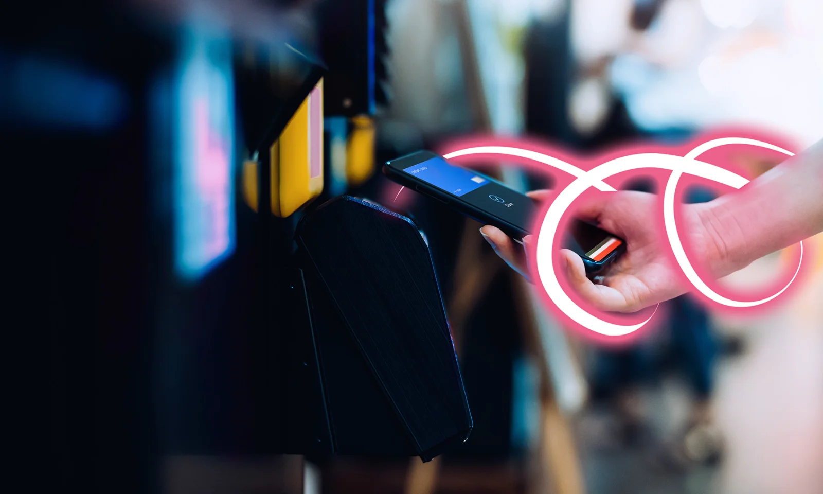 Core Banking 7 Hand holding a smartphone making a contactless payment with a glowing pink ribbon accent.
