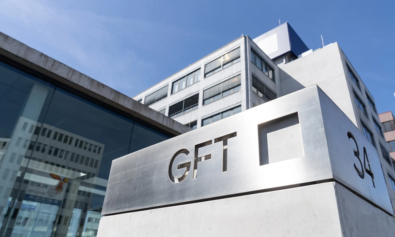 GFT Headquarters Exterior A view of the exterior of GFT's headquarters building, featuring the company's logo and modern architectural design.