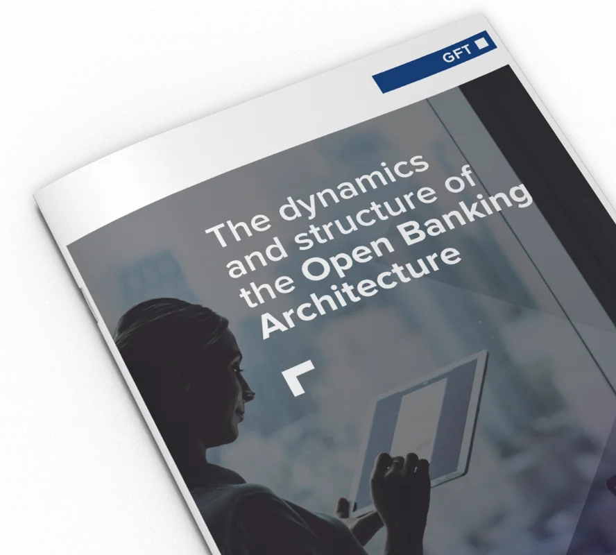 The Dynamics and Structure of the Open Banking Architecture A close-up of a GFT publication titled "The Dynamics and Structure of the Open Banking Architecture," featuring a professional in a high-tech environment, highlighting the The Dynamics and Structure of the Open Banking Architecture.