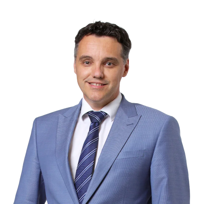 Marcel Fleisch, Contact at VP Bank Portrait of Marcel Fleisch, a contact representative from VP Bank, wearing a light blue suit and striped tie.